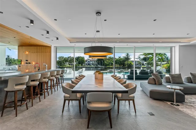 a kitchen with stainless steel appliances granite countertop a sink and a refrigerator