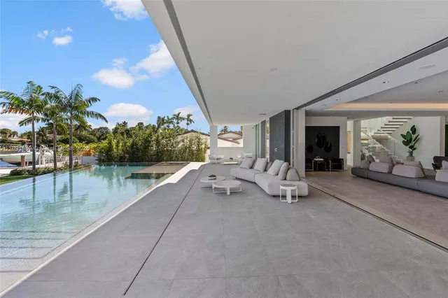 a view of balcony with furniture and city view
