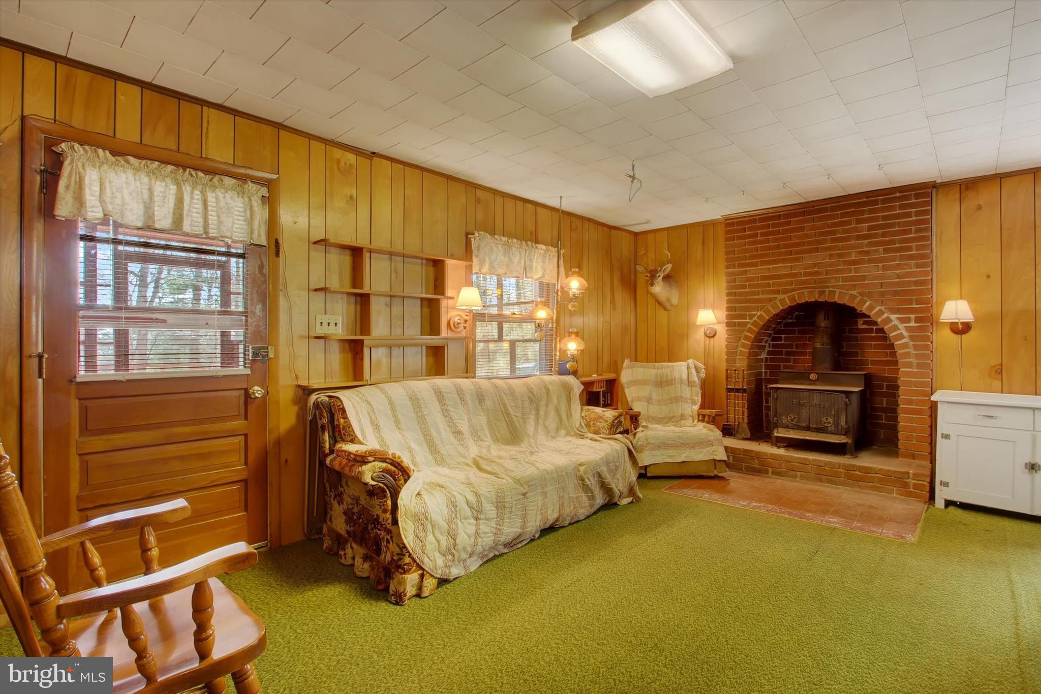 50 Boyds Schoolhouse Road Biglerville, PA 17307 - Photo 7 of 26 a living room with furniture a fireplace and a flat screen tv