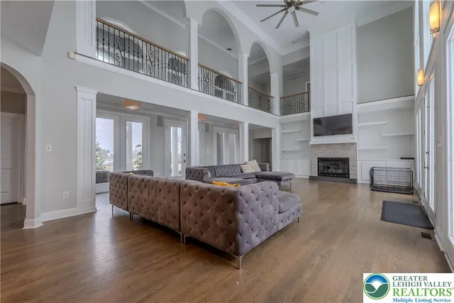 a livingroom with workspace and a couch