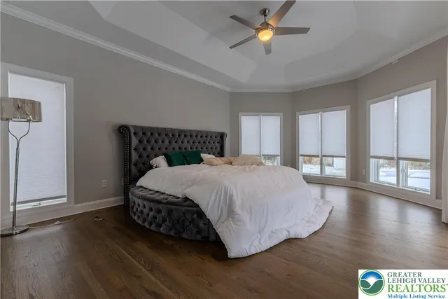 a spacious bathroom with a bathtub and 2 sink