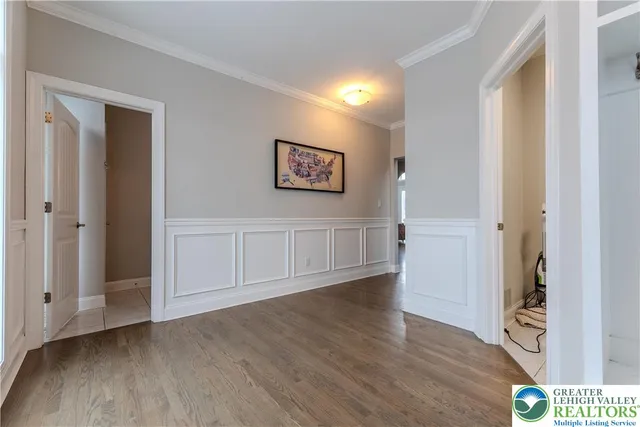 a kitchen with kitchen island stainless steel appliances a table and chairs in it