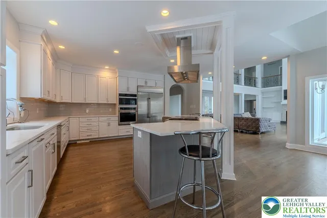 a bathroom with a sink a mirror and a toilet