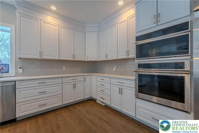 a white toilet sitting next to a bathroom sink