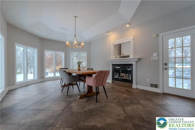 a bathroom with a granite countertop toilet and a sink