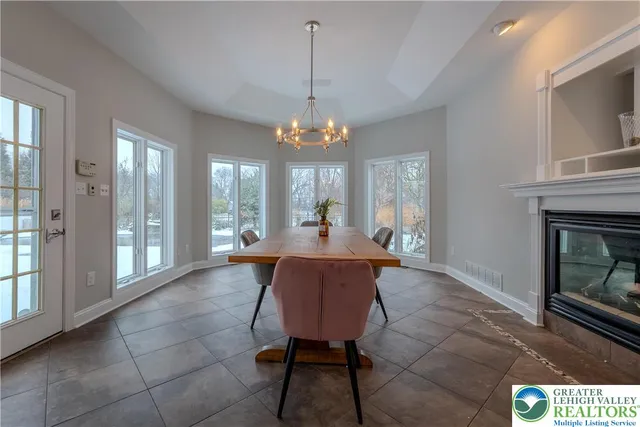 a front view of a house with windows and yard