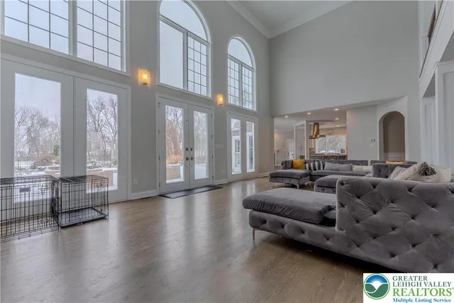 a view of a hallway with wooden floor and a fireplace