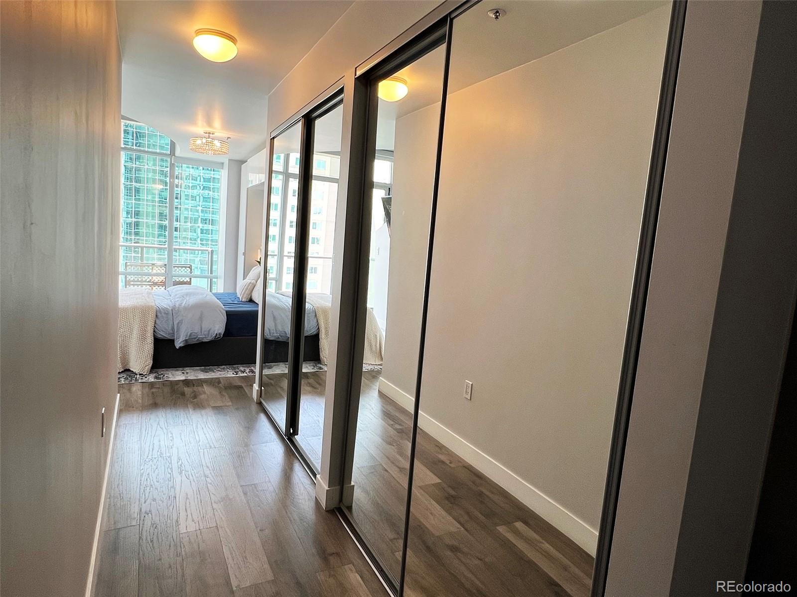 891 14th Street, Unit 1614 Denver, CO 80202 - Photo 20 of 49 a view of room with wooden floor and chair