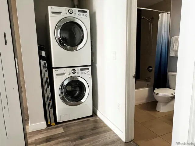 a bathroom with a toilet and bathtub