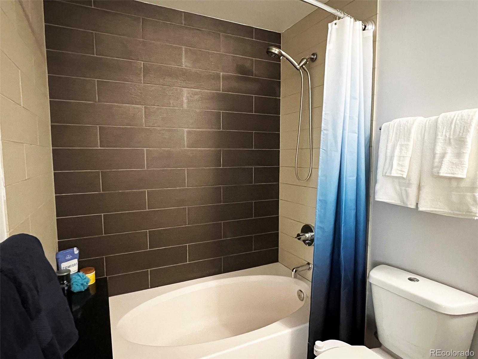 891 14th Street, Unit 1614 Denver, CO 80202 - Photo 24 of 49 a bathroom with a toilet and bathtub