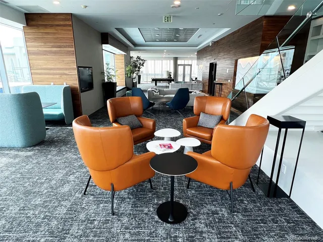 a living room with furniture a window and a table