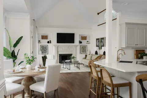 a living room with furniture fireplace and flat screen tv