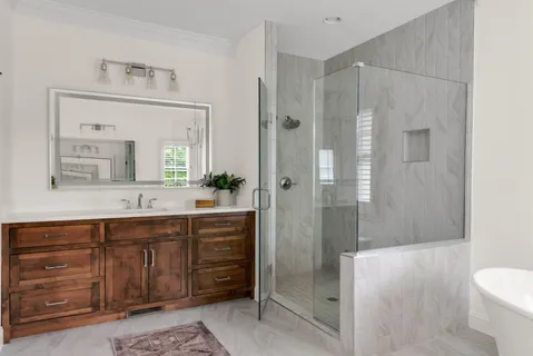 a bathroom with a toilet sink and mirror