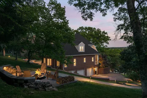 a view of a livingroom with furniture and a window