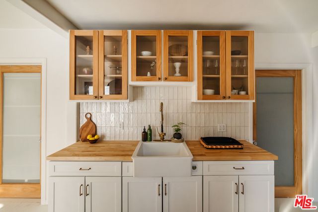 a kitchen with a stove and a cabinets