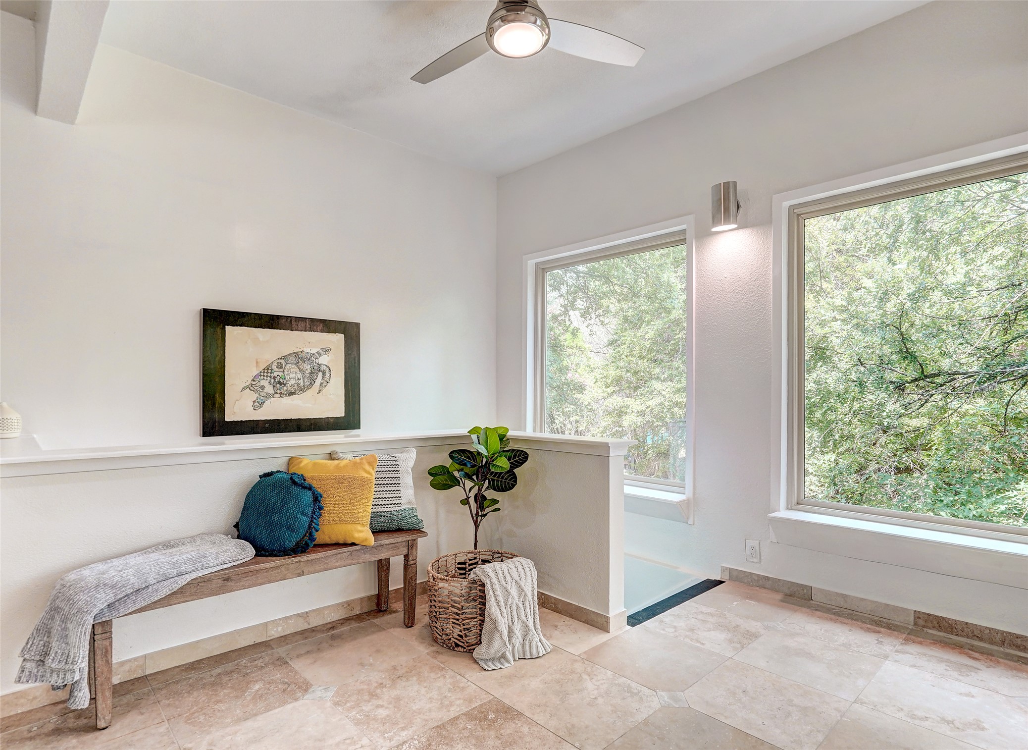 8804 Mountain Ridge Drive, Unit A Austin, TX 78759 - Photo 11 of 37 Sitting room featuring a ceiling fan and light stone finish floors