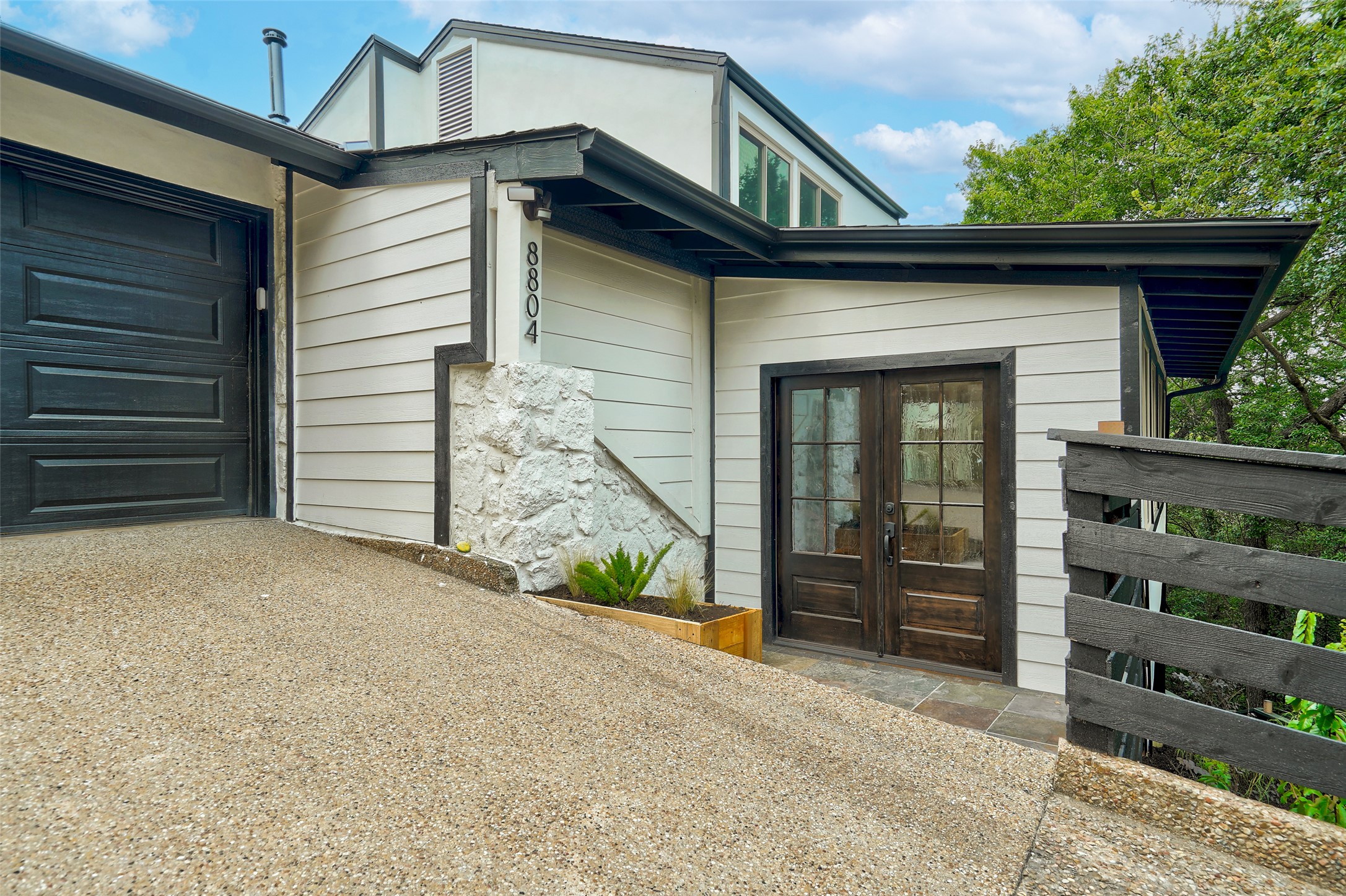 8804 Mountain Ridge Drive, Unit A Austin, TX 78759 - Photo 2 of 37 Property entrance featuring a garage and french doors