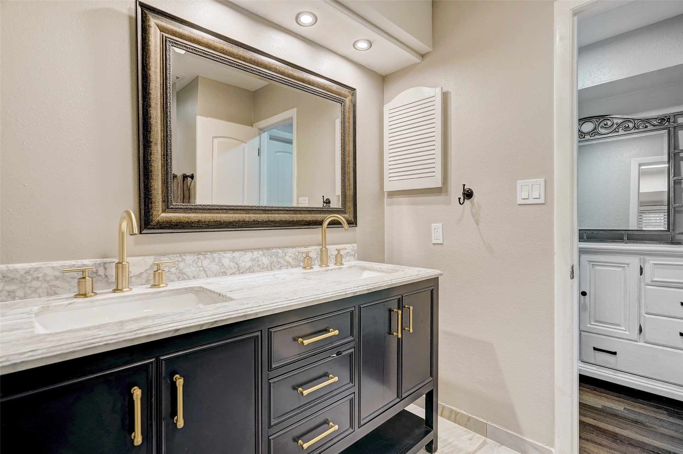 8804 Mountain Ridge Drive, Unit A Austin, TX 78759 - Photo 24 of 37 Bathroom featuring double vanity and a textured wall