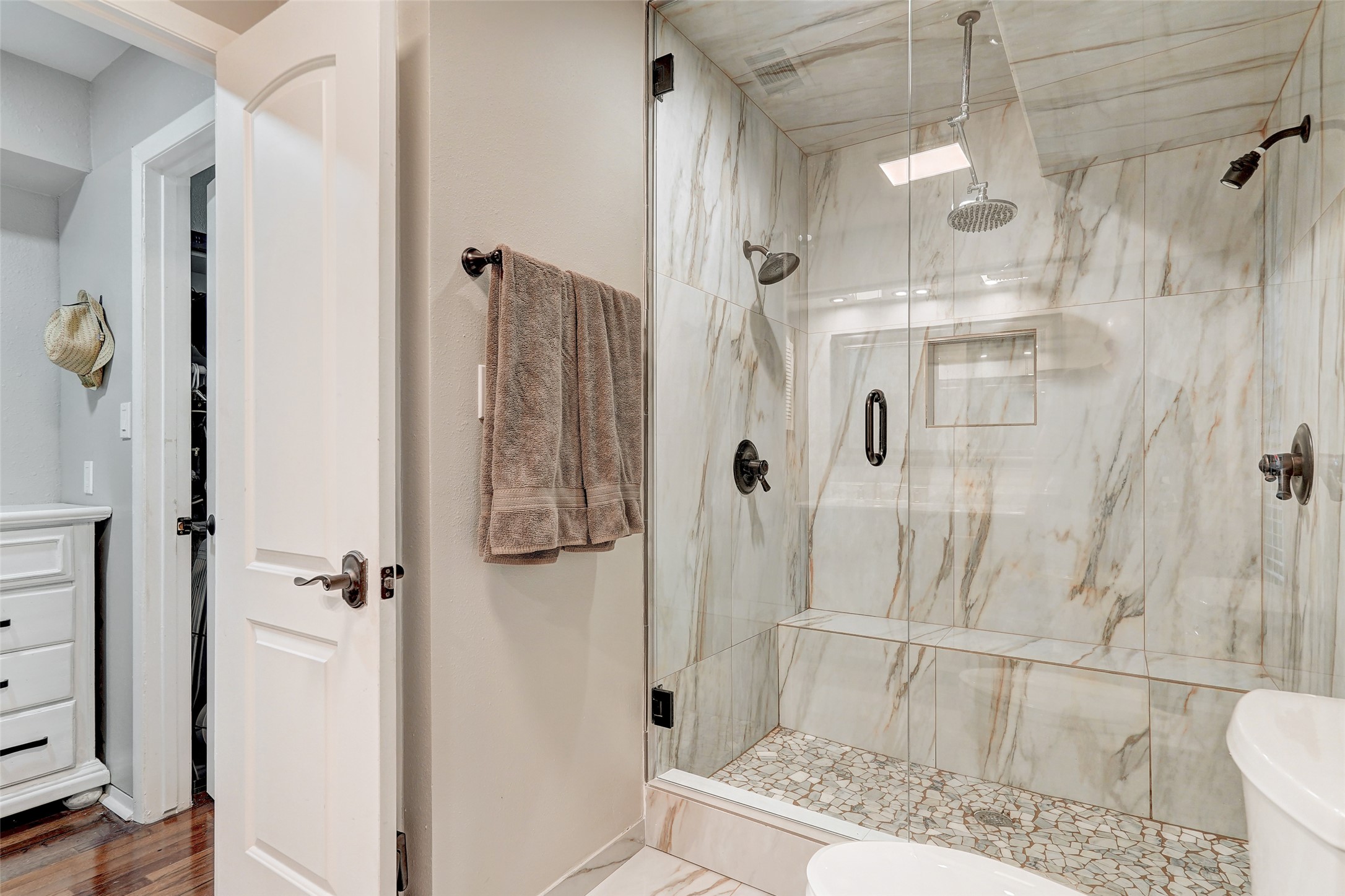 8804 Mountain Ridge Drive, Unit A Austin, TX 78759 - Photo 25 of 37 Bathroom with toilet and a marble finish shower