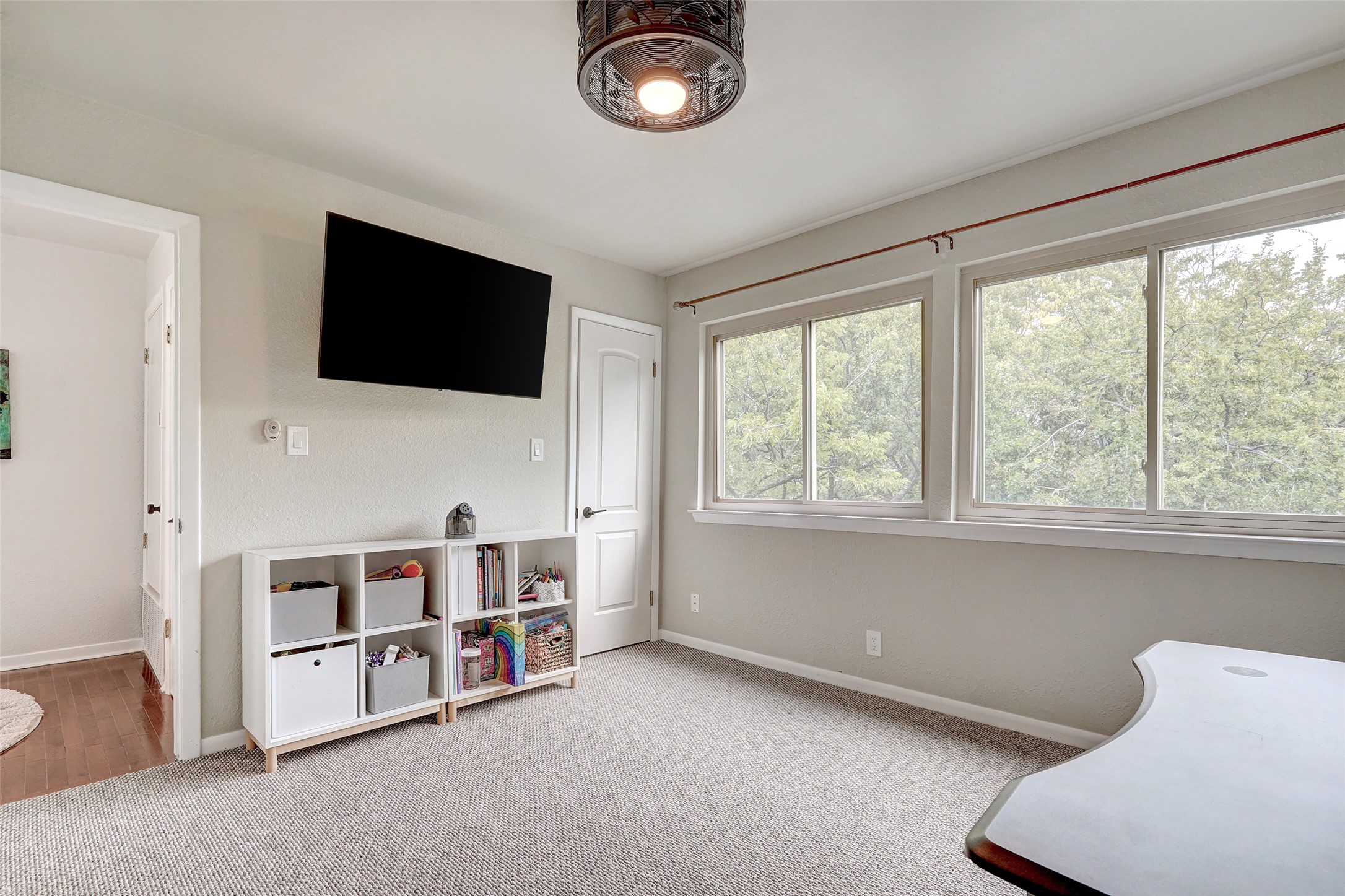 8804 Mountain Ridge Drive, Unit A Austin, TX 78759 - Photo 28 of 37 Living area with light carpet and baseboards