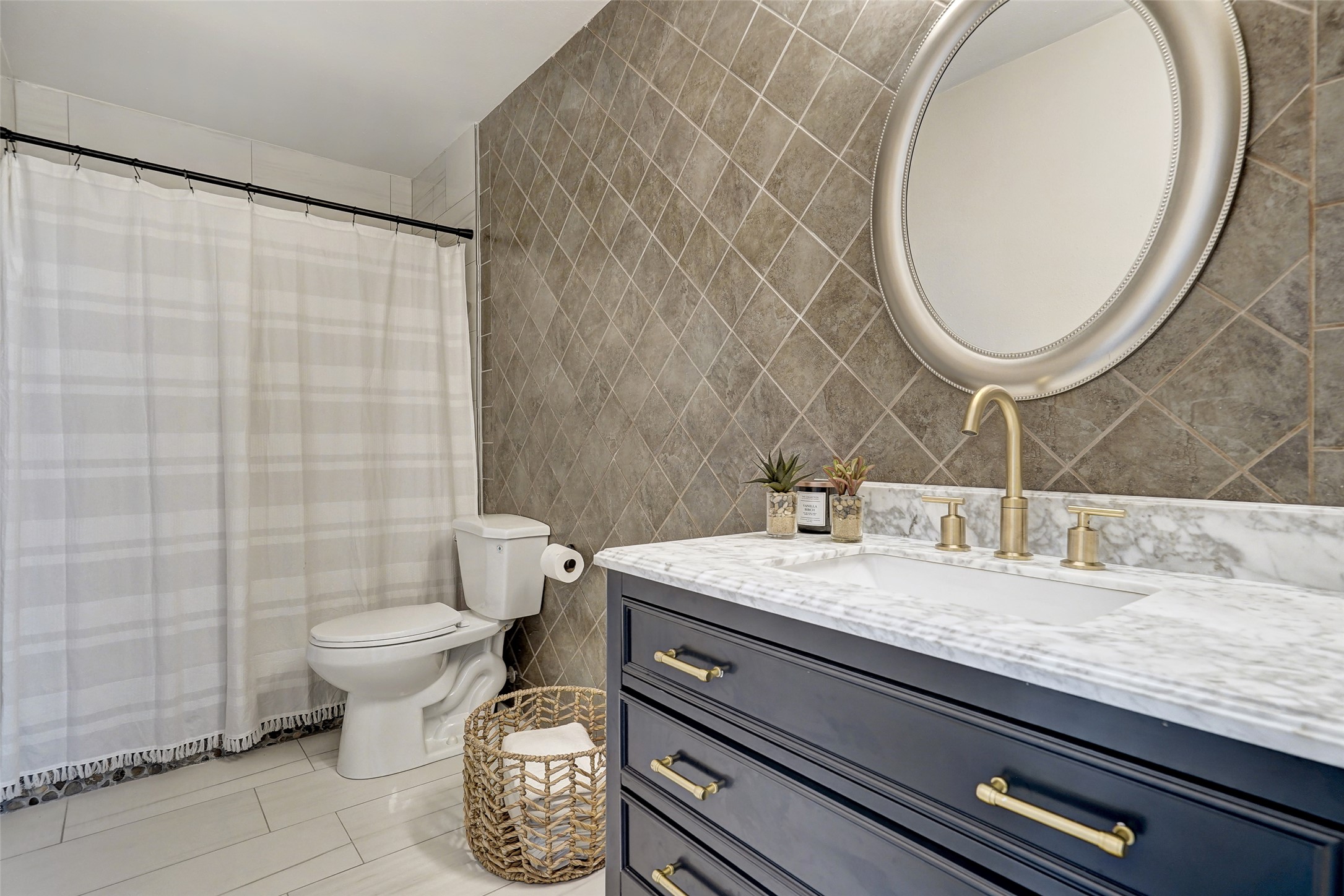 8804 Mountain Ridge Drive, Unit A Austin, TX 78759 - Photo 30 of 37 Bathroom with tile walls, vanity, a shower with shower curtain, and light tile patterned floors