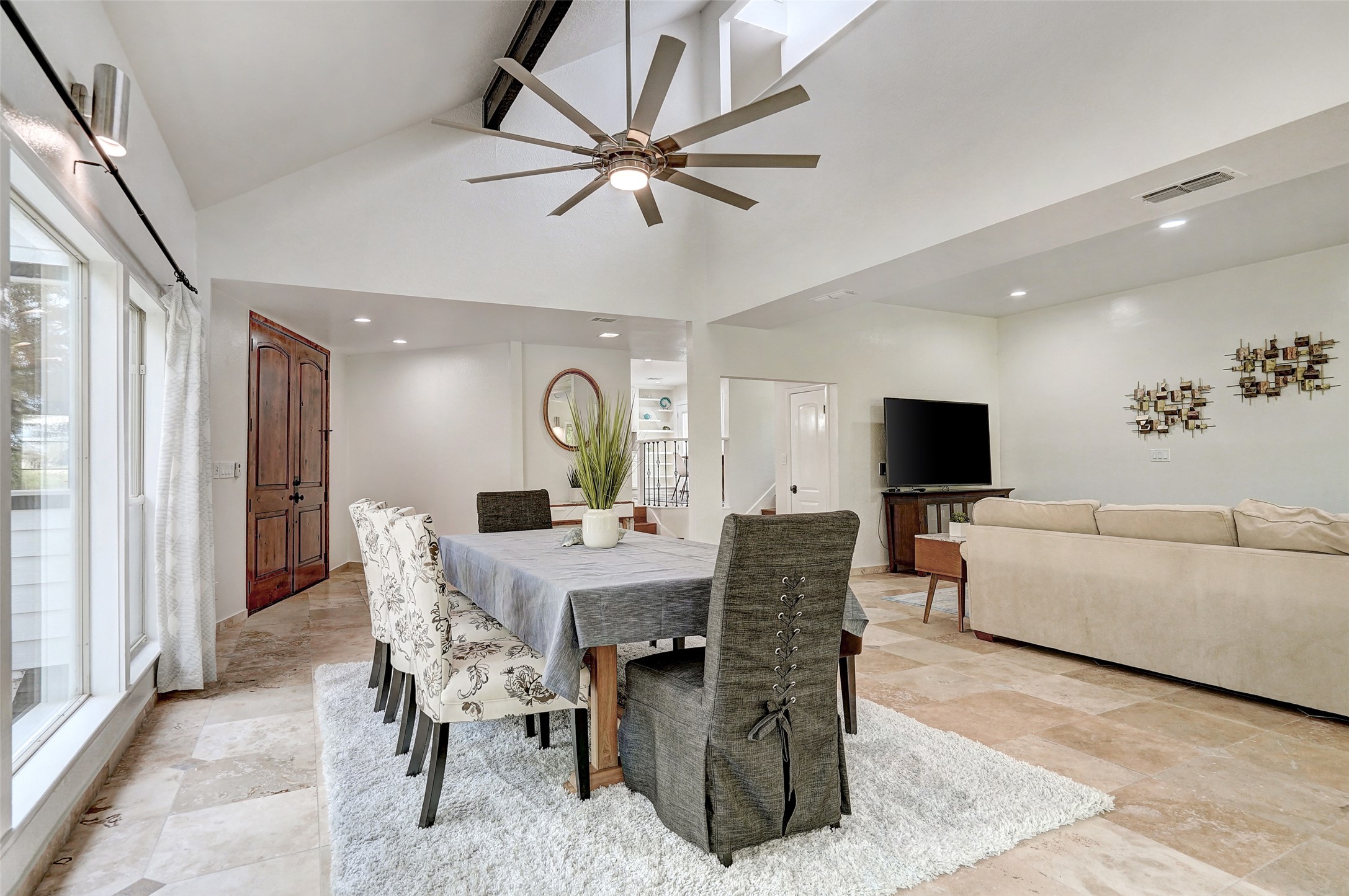 8804 Mountain Ridge Drive, Unit A Austin, TX 78759 - Photo 9 of 37 Dining room with a ceiling fan, vaulted ceiling, and recessed lighting