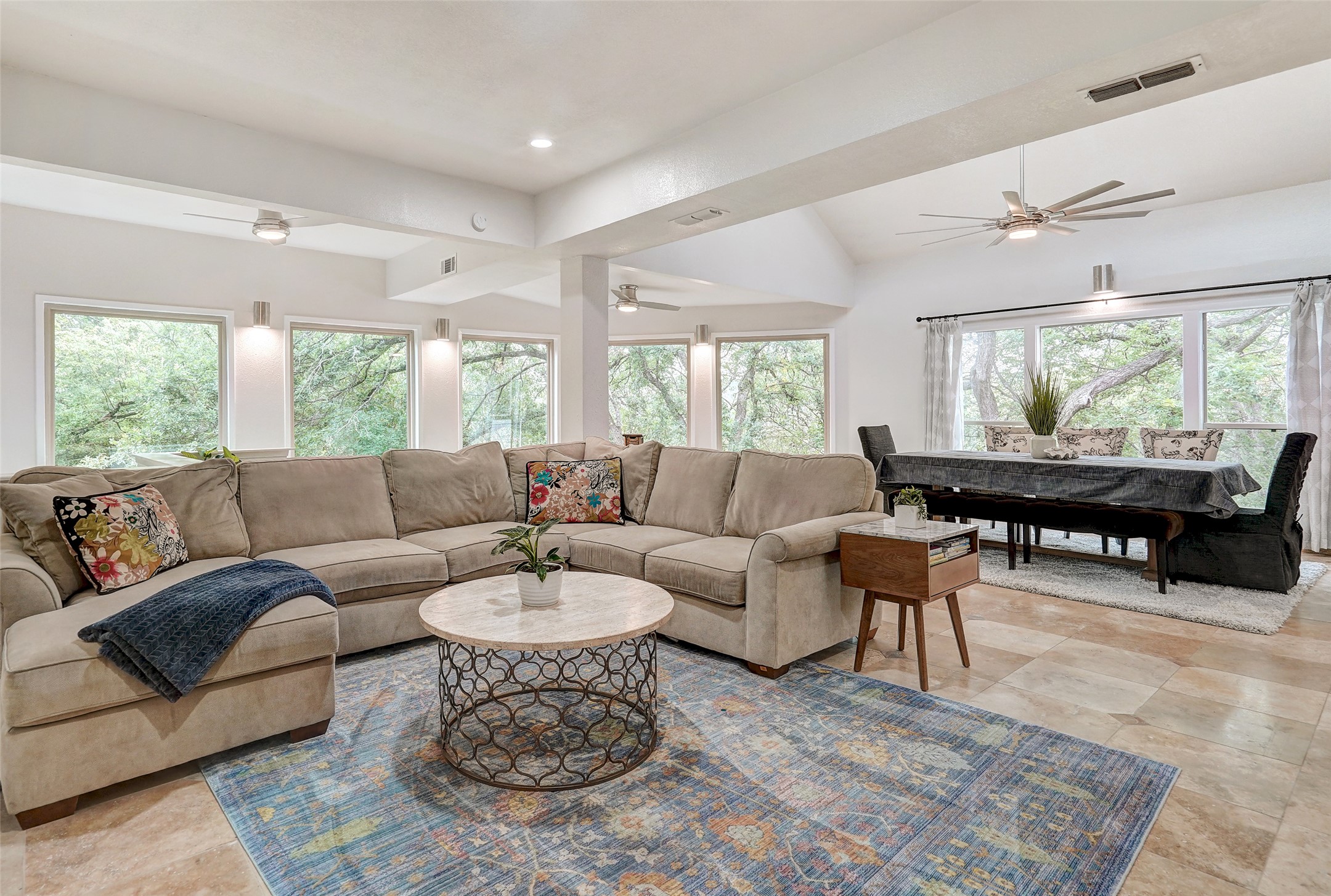 8804 Mountain Ridge Drive, Unit A Austin, TX 78759 - Photo 10 of 37 Living room with healthy amount of natural light, lofted ceiling, a ceiling fan, and recessed lighting