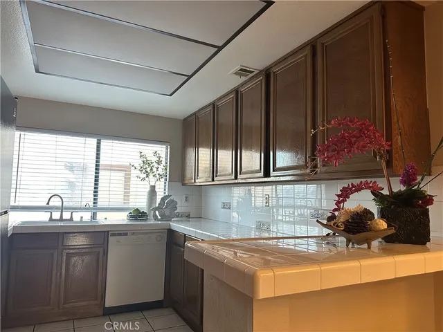 a bedroom with bed and window