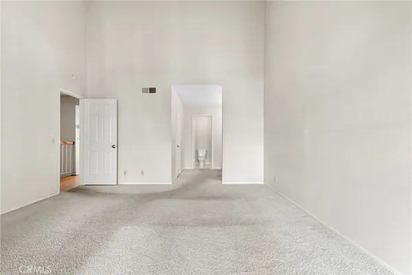 a bathroom with double vanity sinks and a mirror