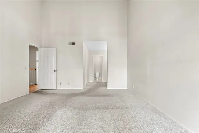 a bathroom with double vanity sinks and a mirror