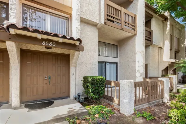 a front view of a house with stairs