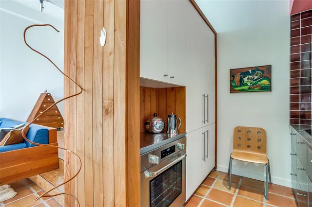 a bedroom with a bed and chair