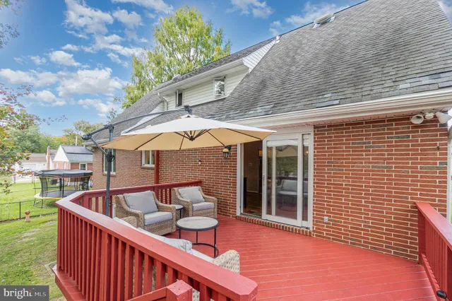 a view of outdoor sitting area with furniture and garden