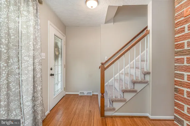 a view of entryway with wooden floor