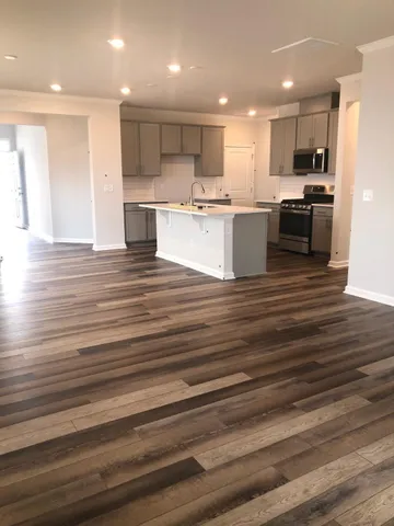 a view of kitchen kitchen microwave and cabinets