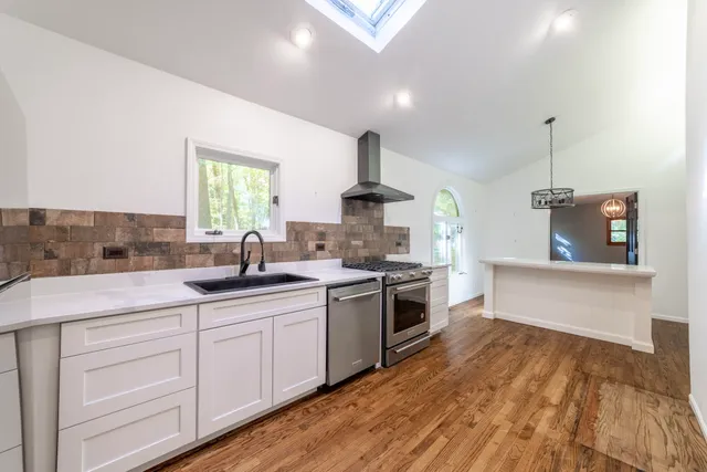 a view of a big room with closet and windows