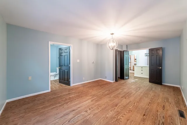 a bathroom with a sink toilet and window