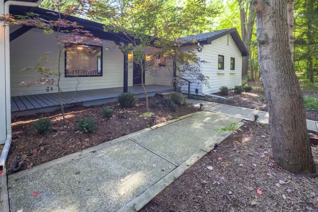 a front view of a house with garden