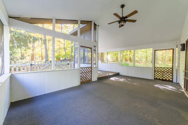 a view of an empty room with a fireplace