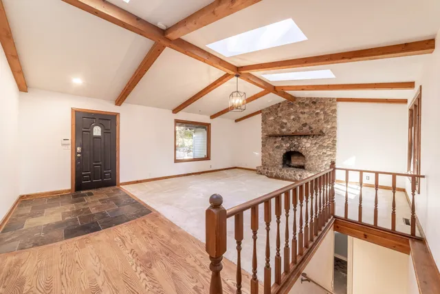 a view of a dining room with furniture wooden floor and a chandelier
