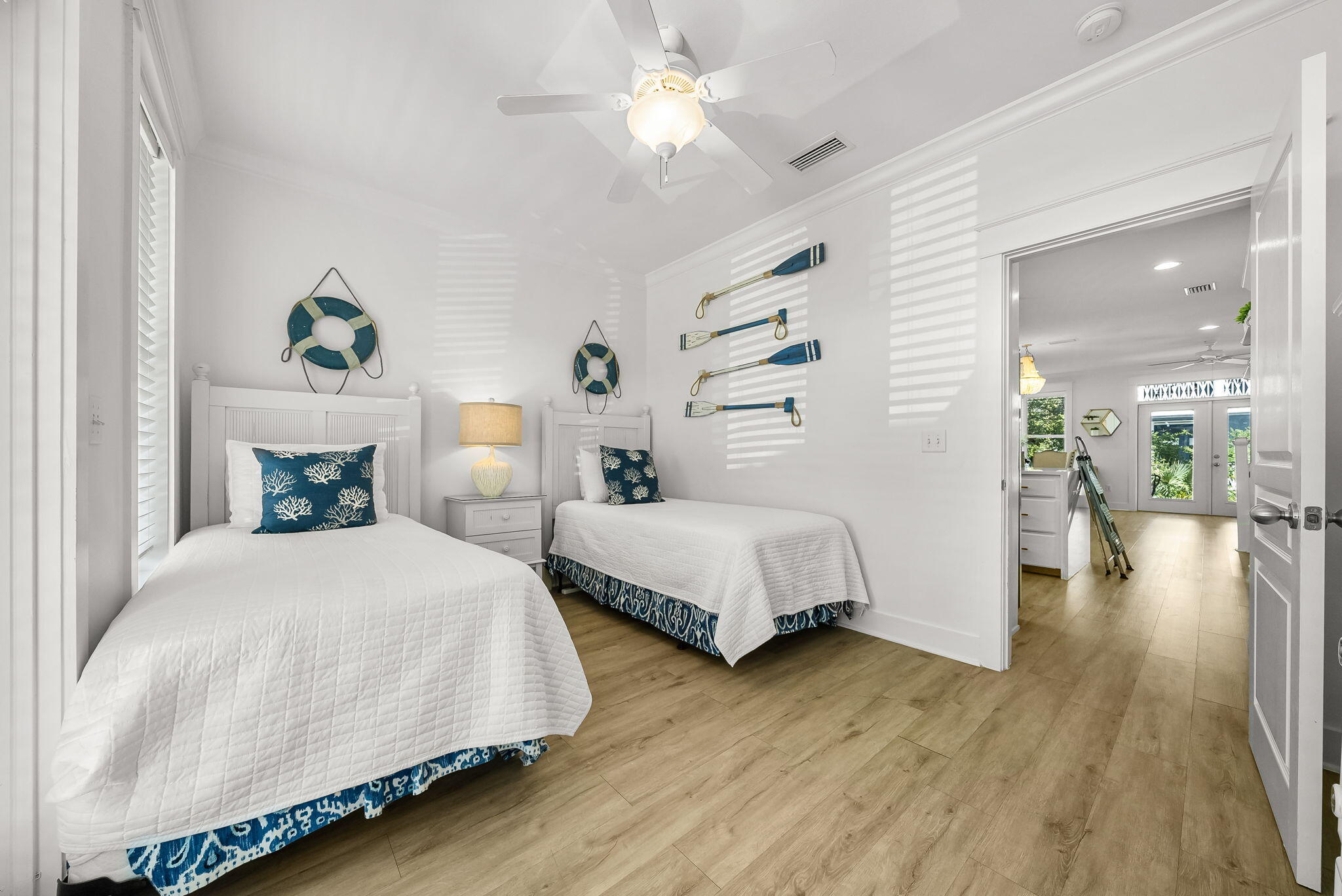 22 Moonlight Beach Lane Inlet Beach, FL 32461 - Photo 11 of 70 a bedroom with two beds and a chandelier