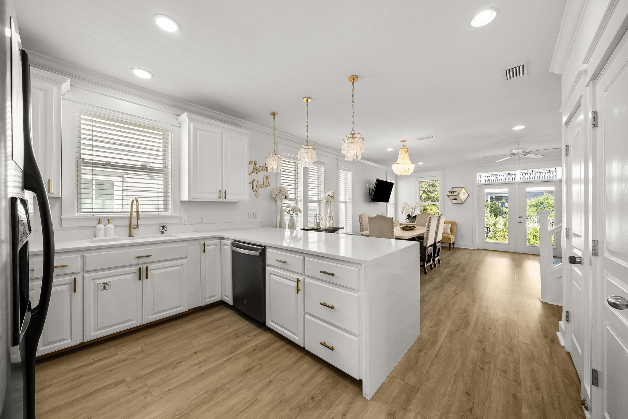 22 Moonlight Beach Lane Inlet Beach, FL 32461 - Photo 15 of 70 a large kitchen with kitchen island white cabinets and stainless steel appliances