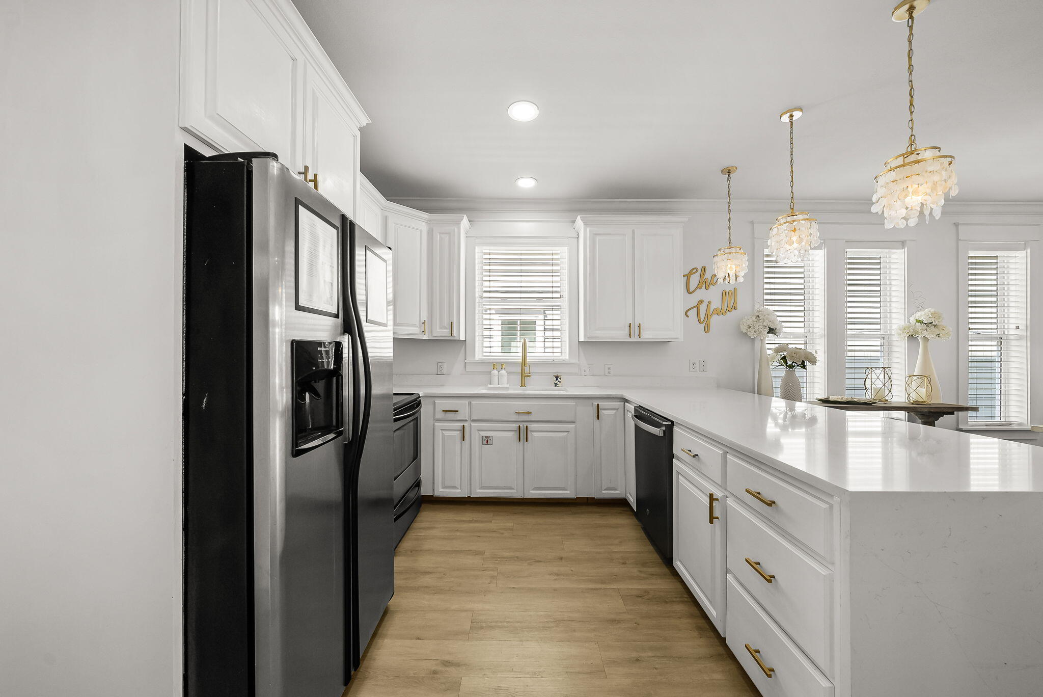 22 Moonlight Beach Lane Inlet Beach, FL 32461 - Photo 16 of 70 a kitchen with stainless steel appliances granite countertop a refrigerator a sink dishwasher a oven and a dining table with wooden floor