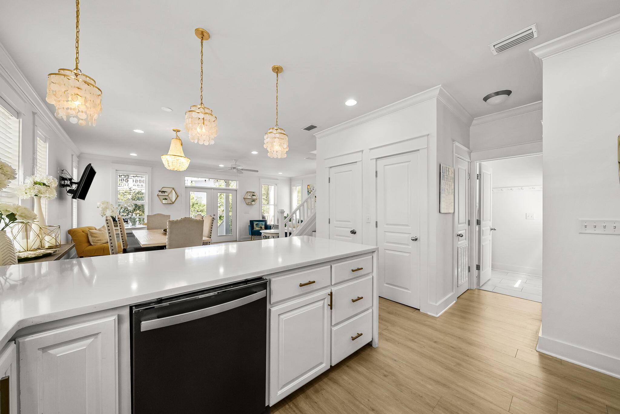 22 Moonlight Beach Lane Inlet Beach, FL 32461 - Photo 17 of 70 a open kitchen with stainless steel appliances granite countertop a sink a island a stove and a wooden floors