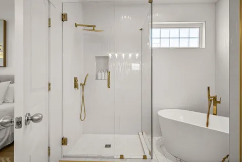 a view of a balcony with wooden chairs