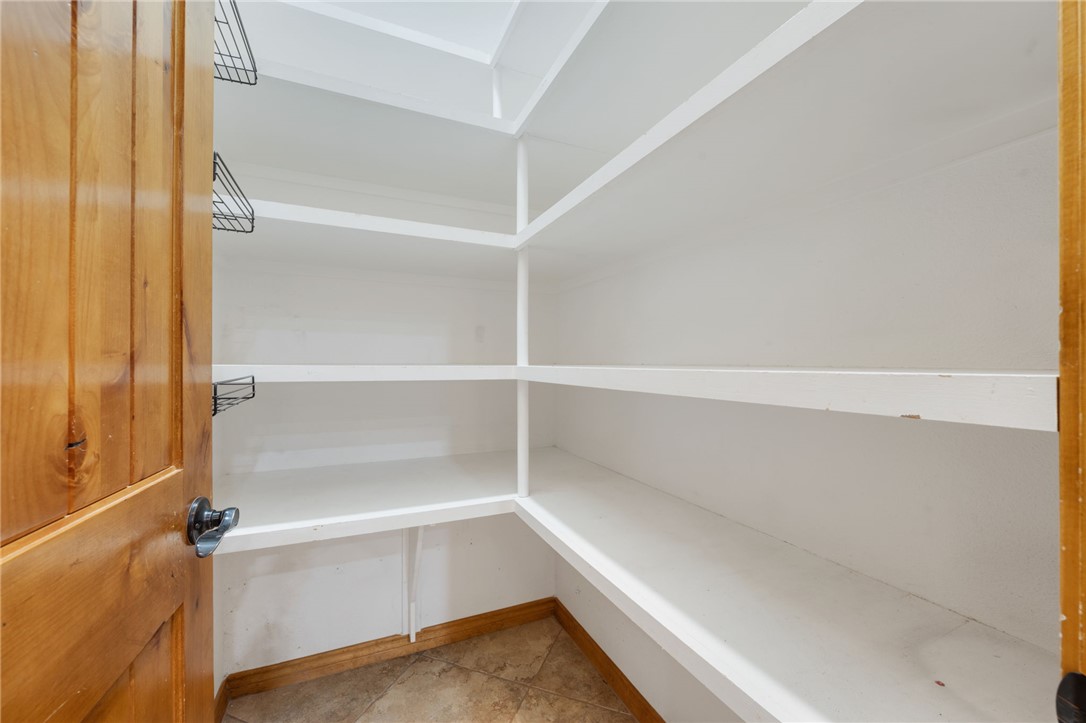7754 Edge Cut Off Road Hearne, TX 77859 - Photo 11 of 49 a view of walk in closet with empty racks