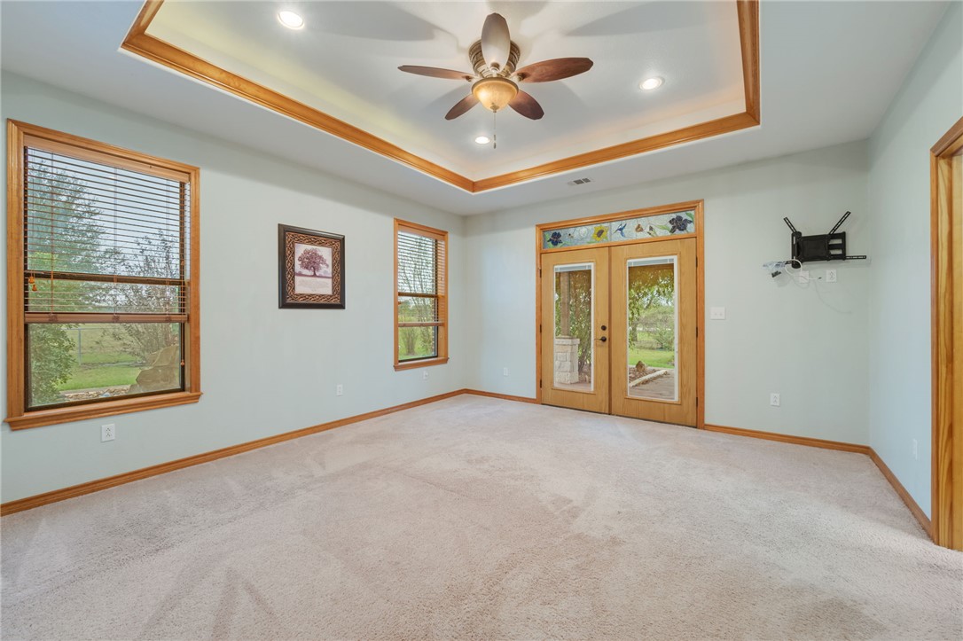 7754 Edge Cut Off Road Hearne, TX 77859 - Photo 13 of 49 an empty room with windows and fan