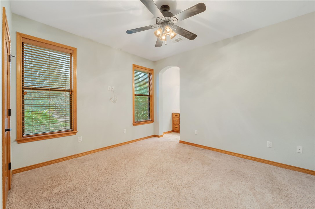 7754 Edge Cut Off Road Hearne, TX 77859 - Photo 25 of 49 an empty room with windows and fan