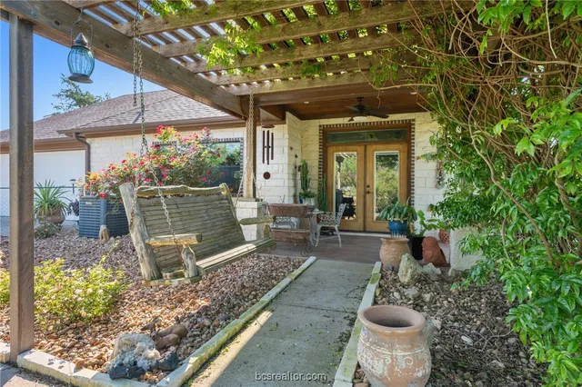 a view of a swimming pool with a patio and a yard