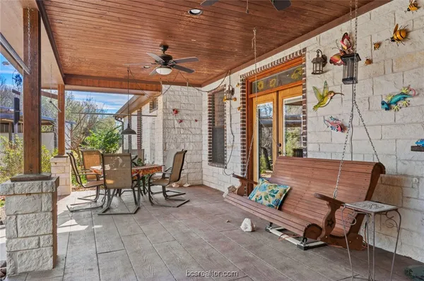 a view of a chairs and table in a patio